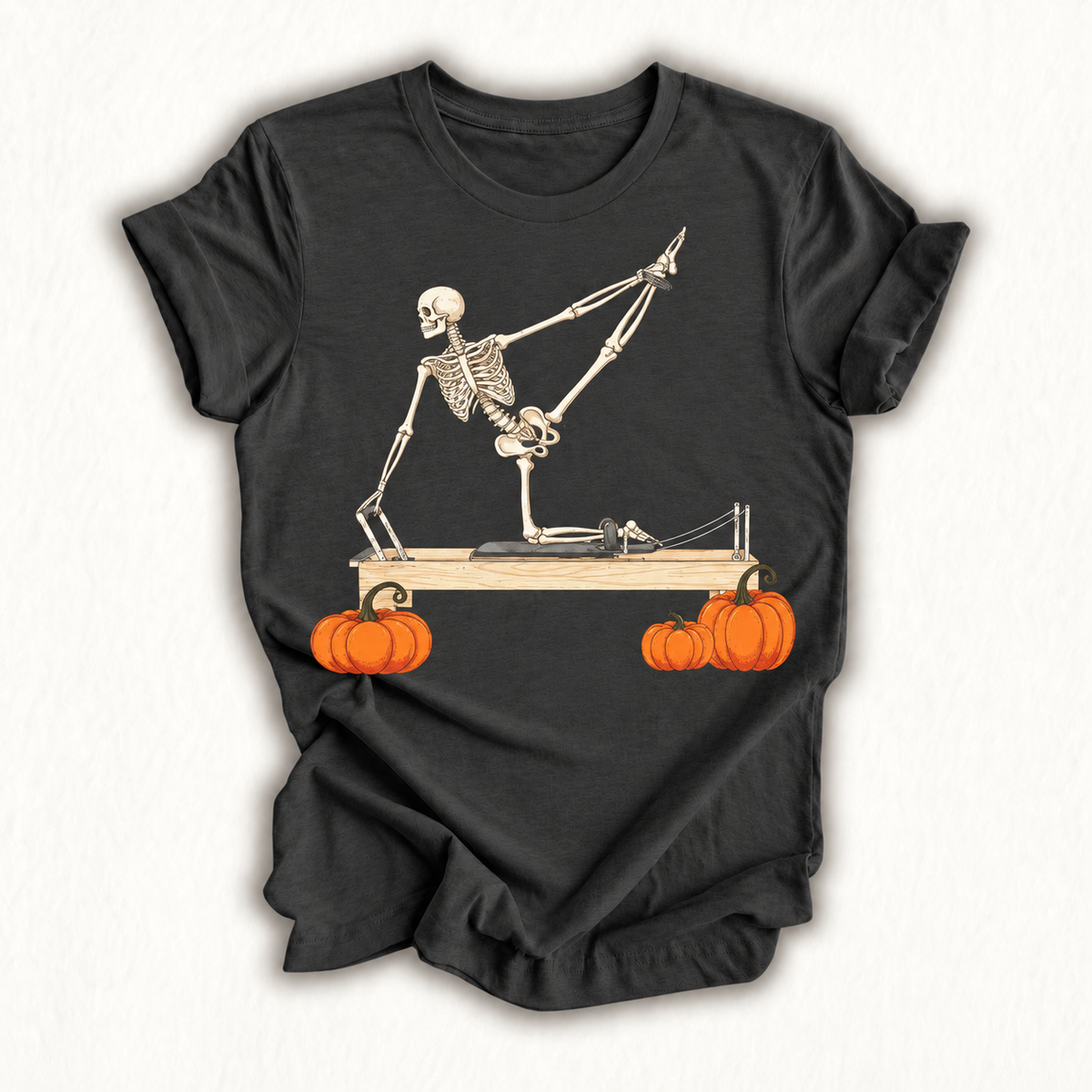 Skeleton Doing Reformer Pilates Machine Pumpkin Halloween T-Shirt