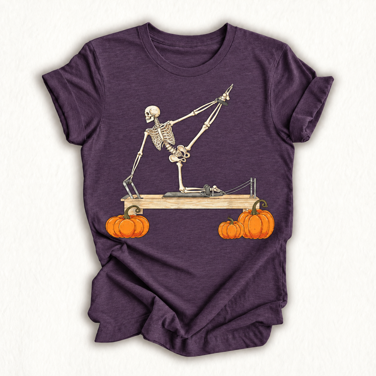 Skeleton Doing Reformer Pilates Machine Pumpkin Halloween T-Shirt