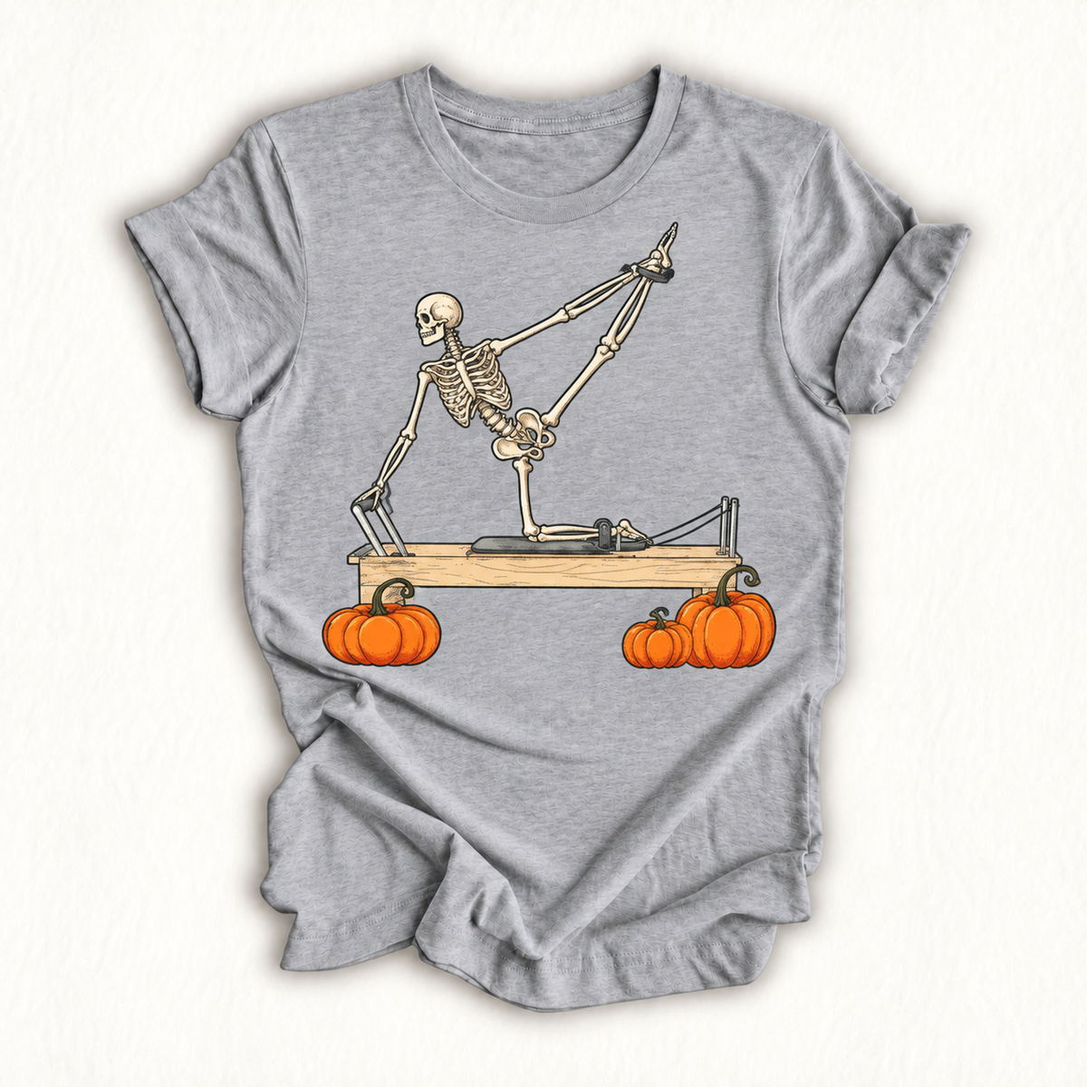 Skeleton Doing Reformer Pilates Machine Pumpkin Halloween T-Shirt